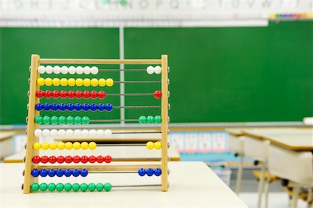 Abacus on Desk in Classroom Stock Photo - Rights-Managed, Code: 700-02121496