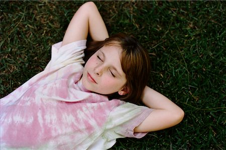 Girl Lying in Grass Stock Photo - Rights-Managed, Code: 700-02130197