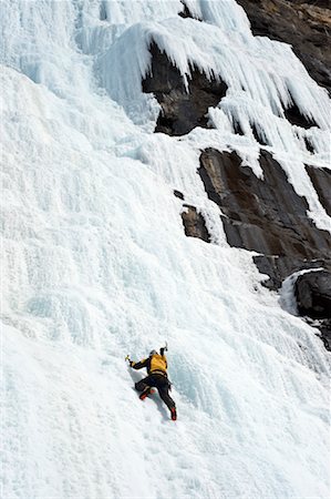 Ice Climber on Frozen Waterfall, Near Jasper, Alberta, Canada Foto de stock - Con derechos protegidos, Código: 700-02130520