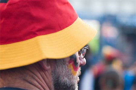 picture of a crowd watching a game - Sports Fan Wearing Hat in Colours of Germany, Euro 2008, Salzburg, Austria Stock Photo - Rights-Managed, Code: 700-02130790