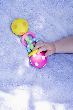 Baby Holding Rattle Stock Photo - Rights-Managed, Code: 700-02156611