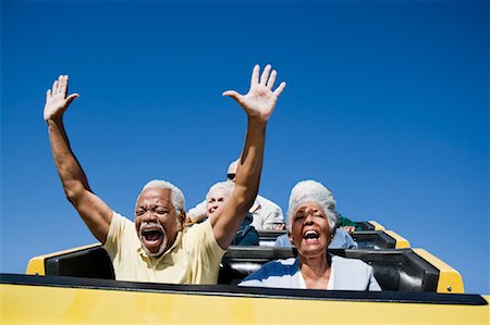 people riding roller coasters - People on Roller Coaster, Santa Monica, California, USA Foto de stock - Con derechos protegidos, Código: 700-02156936