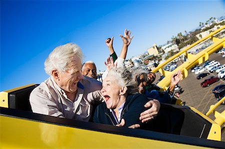 people riding roller coasters - People on Roller Coaster, Santa Monica, California, USA Foto de stock - Con derechos protegidos, Código: 700-02156945