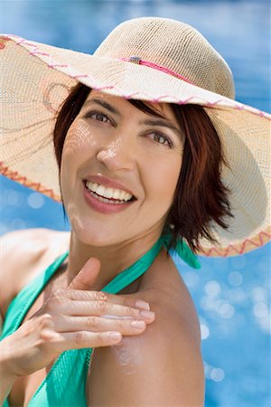 sparkling water (not drinking water) - Woman Applying Sunscreen Stock Photo - Rights-Managed, Code: 700-02200844