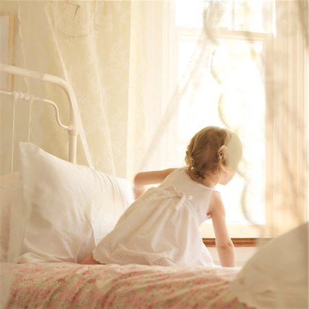rear view little girl - Little Girl in Bedroom, Looking Out Window Stock Photo - Rights-Managed, Code: 700-02217413