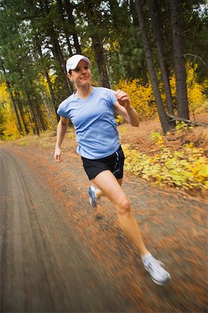 simsearch:700-02245399,k - Woman Running in Forest, Methow Valley, Near Mazama, Washington, USA Stock Photo - Rights-Managed, Code: 700-02245565