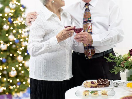simsearch:700-02264289,k - Couple Drinking Wine at Christmas Party Stock Photo - Rights-Managed, Code: 700-02264287