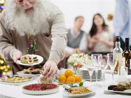 simsearch:700-02264289,k - People Eating Hors D'Oeuvres at Christmas Party Stock Photo - Rights-Managed, Code: 700-02264292