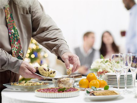 simsearch:700-02264289,k - People Eating Hors D'Oeuvres at Christmas Party Stock Photo - Rights-Managed, Code: 700-02264293