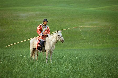 Horseman in Field, Inner Mongolia, China Stock Photo - Rights-Managed, Code: 700-02264836