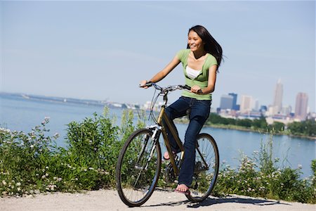 Woman Riding Bicycle on Path by Water Stock Photo - Rights-Managed, Code: 700-02264935