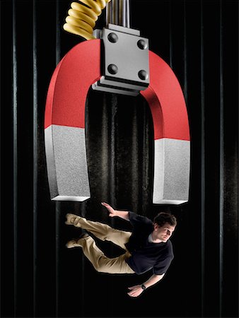 physics - Magnet Picking Up Man Stock Photo - Rights-Managed, Code: 700-02265026