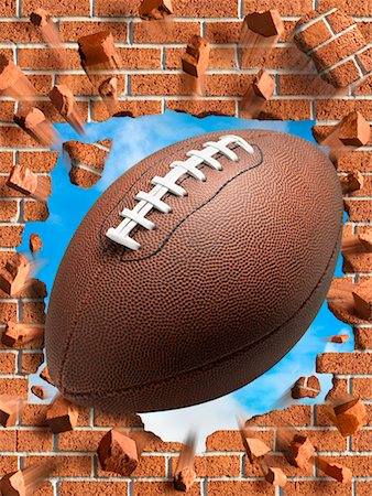 exploding (contents under pressure) - Football Smashing Through Brick Wall Stock Photo - Rights-Managed, Code: 700-02265044