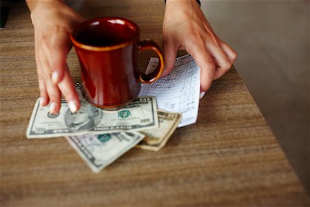 Woman's Hands Paying Restaurant Bill Stock Photo - Rights-Managed, Code: 700-02265388