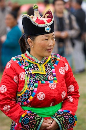 Woman Competing in Costume Contest at the Naadam Festival, Xiwuzhumuqinqi, Inner Mongolia, China Stock Photo - Rights-Managed, Code: 700-02265741