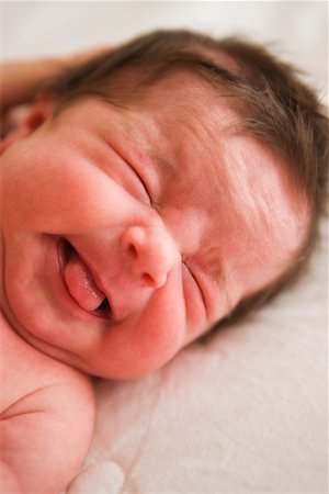 Newborn Baby Girl Making Faces Stock Photo - Rights-Managed, Code: 700-02263906