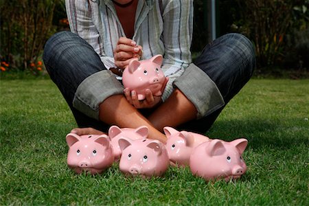 Woman on Grass with Piggy Banks Stock Photo - Rights-Managed, Code: 700-02289312