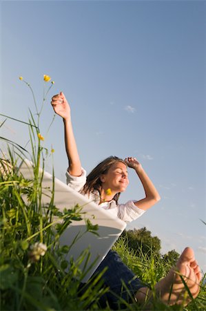 Woman With Laptop Looking Happy, Salzburg, Salzburger Land, Austria Stock Photo - Rights-Managed, Code: 700-02315092