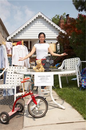 Woman Selling Items at a Garage Sale Stock Photo - Rights-Managed, Code: 700-02347885