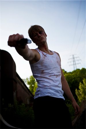 Criminal Pointing Gun at Camera, Toronto, Ontario, Canada Stock Photo - Rights-Managed, Code: 700-02348217