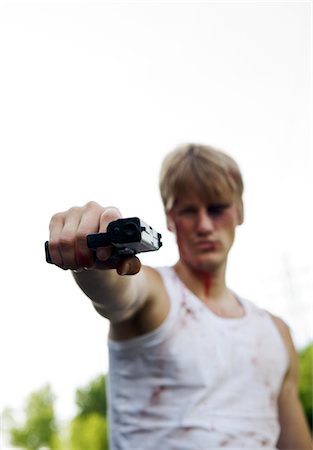 sin - Criminal Pointing Gun at Camera, Toronto, Ontario, Canada Stock Photo - Rights-Managed, Code: 700-02348219