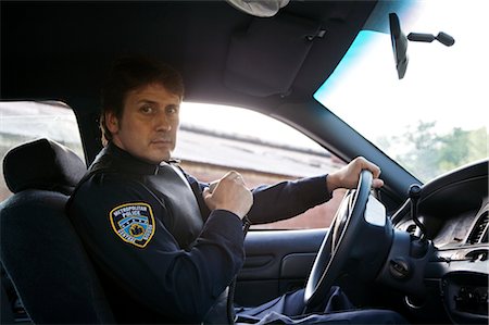 police portrait - Police Officer in Cruiser with CB Radio, Toronto, Ontario, Canada Stock Photo - Rights-Managed, Code: 700-02348225