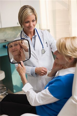 Patient in Doctor's Office, Examining Skin Stock Photo - Rights-Managed, Code: 700-02377769