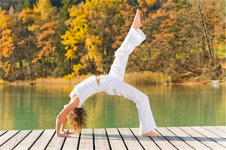 Woman Practicing Yoga on Dock, Fuschlsee, Salzkammergut, Salzburg, Austria Stock Photo - Rights-Managed, Code: 700-02428614