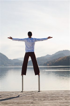 simsearch:700-00606337,k - Man Balancing on Dock Ladder, Fuschlsee, Fuschl am See, Salzkammergut, Salzburger Land, Austria Stock Photo - Rights-Managed, Code: 700-02428736