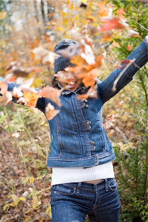 Woman Throwing Autumn Leaves Stock Photo - Rights-Managed, Code: 700-02637170