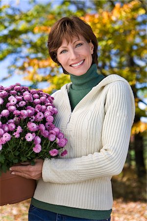 Woman Holding Potted Plant Stock Photo - Rights-Managed, Code: 700-02637928