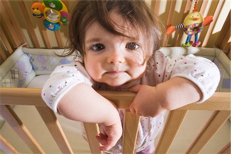 Portrait of Baby Girl Standing in Crib Stock Photo - Rights-Managed, Code: 700-02633416
