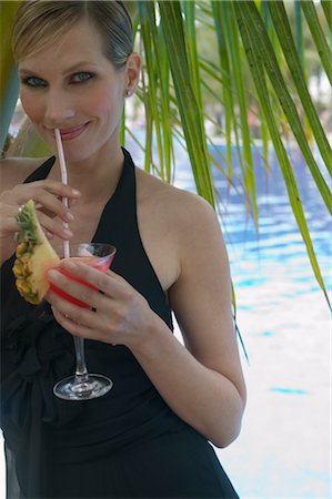simsearch:400-04398921,k - Portrait of Woman Sipping Cocktail Stock Photo - Rights-Managed, Code: 700-02645882