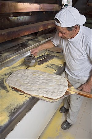 Baker Pouring Olive Oil on Pizza Dough, Cerreto Laziale, Tivoli, Rome, Italy Stock Photo - Rights-Managed, Code: 700-02659609