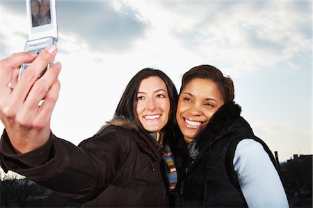 Women Taking Pictures of Themselves With Cell Phone Stock Photo - Rights-Managed, Code: 700-02670513