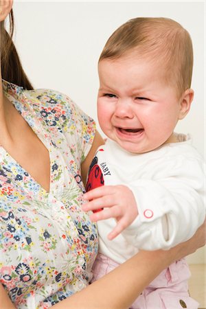 Woman Holding Crying Baby Stock Photo - Rights-Managed, Code: 700-02686107