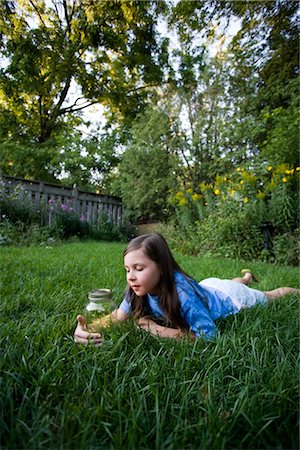 simsearch:700-00477662,k - Girl Lying on Grass Looking at Jar of Fireflies Stock Photo - Rights-Managed, Code: 700-02698407