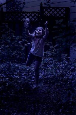 Girl Trying to Catch Fireflies at Night Stock Photo - Rights-Managed, Code: 700-02698410