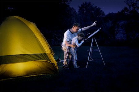 sky stars - Father and Son Camping in the Backyard at Night, Looking Through Telescope Stock Photo - Rights-Managed, Code: 700-02698426