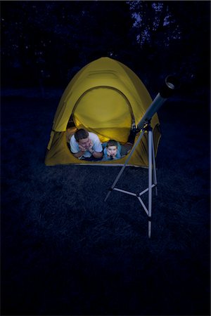 Father and Son With a Telescope, Camping in the Backyard at Night Stock Photo - Rights-Managed, Code: 700-02698421