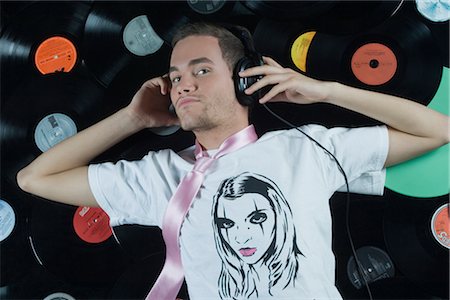 Man Lying on Pile of Records Stock Photo - Rights-Managed, Code: 700-02693769