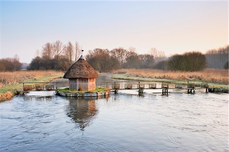 english thatched roof - Traditional Thatched Hut and Salmon Traps Across River Test at Dawn in Winter, Hampshire, England Stock Photo - Rights-Managed, Code: 700-02700647