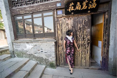suzhou - Woman Standing Outside of Building in Suzhou, China Stock Photo - Rights-Managed, Code: 700-02700770
