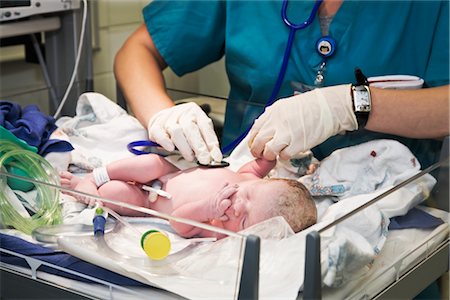 delivery room - Doctor Examining Newborn Stock Photo - Rights-Managed, Code: 700-02701282