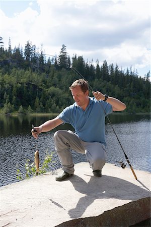 Man Catching Fish, Norway Stock Photo - Rights-Managed, Code: 700-02702603