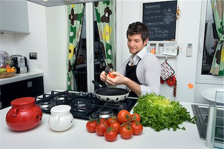 Man in Kitchen Cooking Dinner Stock Photo - Rights-Managed, Code: 700-02756601
