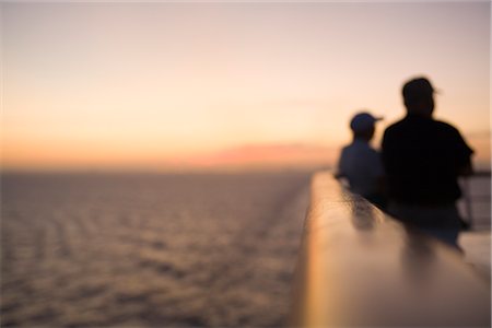 simsearch:600-02633832,k - Men Leaning on Railing, Fort Lauderdale, Florida, USA Stock Photo - Rights-Managed, Code: 700-02798002