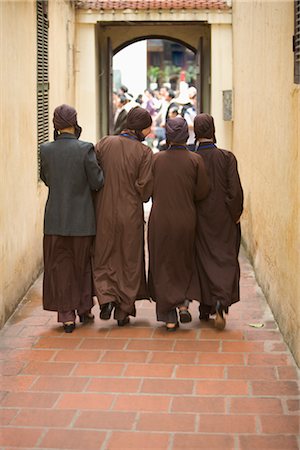 Backview of Novice Nuns Walking in a Passageway in a Temple, Hanoi, Vietnam Stock Photo - Rights-Managed, Code: 700-02828408