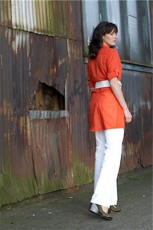 Rear View of Woman Outside Run Down Building Foto de stock - Con derechos protegidos, Código: 700-02833291