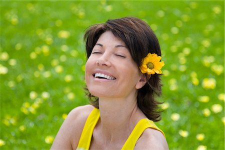 sunning - Portrait of Woman With a Flower in Her Hair Stock Photo - Rights-Managed, Code: 700-02833577